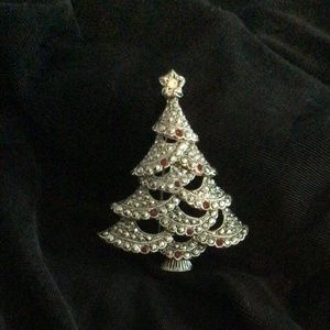 Beautiful silver Christmas tree pin with tiny garnets/clear crystal topper.2”chr